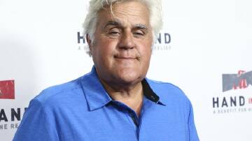 Jay Leno says he broke several bones after being knocked off a vintage motorcycle. (AP PHOTO)