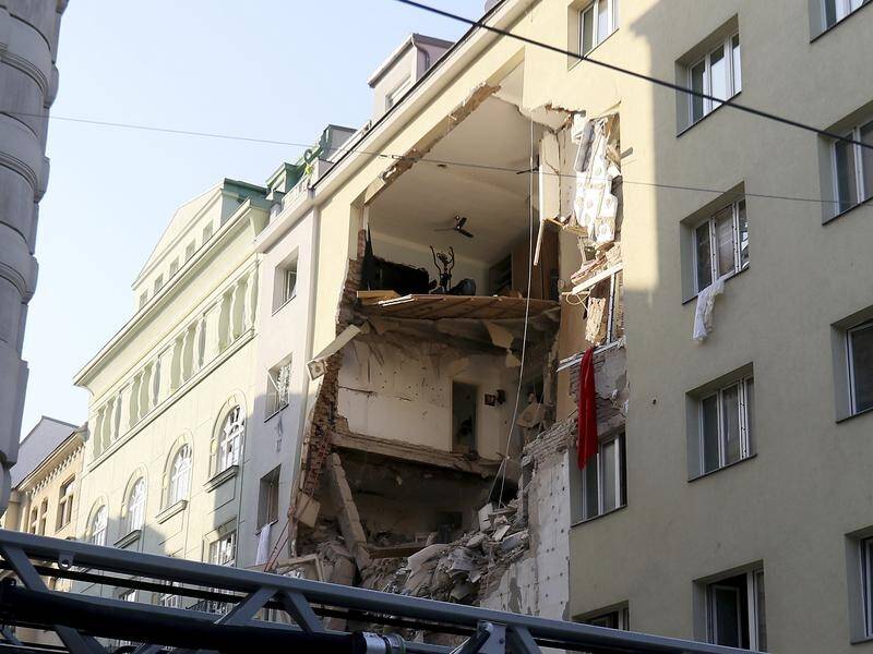 Rescuers are searching through rubble after a Vienna apartment building is hit by an explosion.