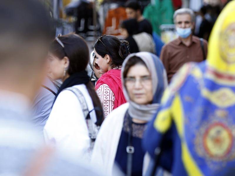 Women walk the streets of Iran without the mandatory headscarf a year on from Mahsa Amini's death. (EPA PHOTO)