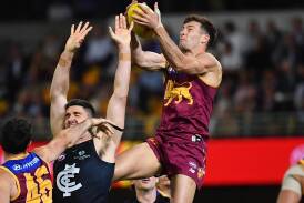 Josh Dunkley (r) subdued Carlton's Patrick Cripps as the Brisbane Lions soared to the grand final. (Jono Searle/AAP PHOTOS)