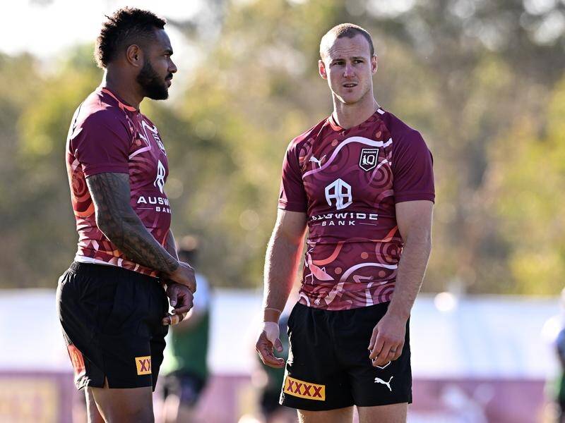 Hamiso Tabuai-Fidow (l) and Daly Cherry-Evans (r) discuss how Qld will take down NSW in Origin I. (Dave Hunt/AAP PHOTOS)