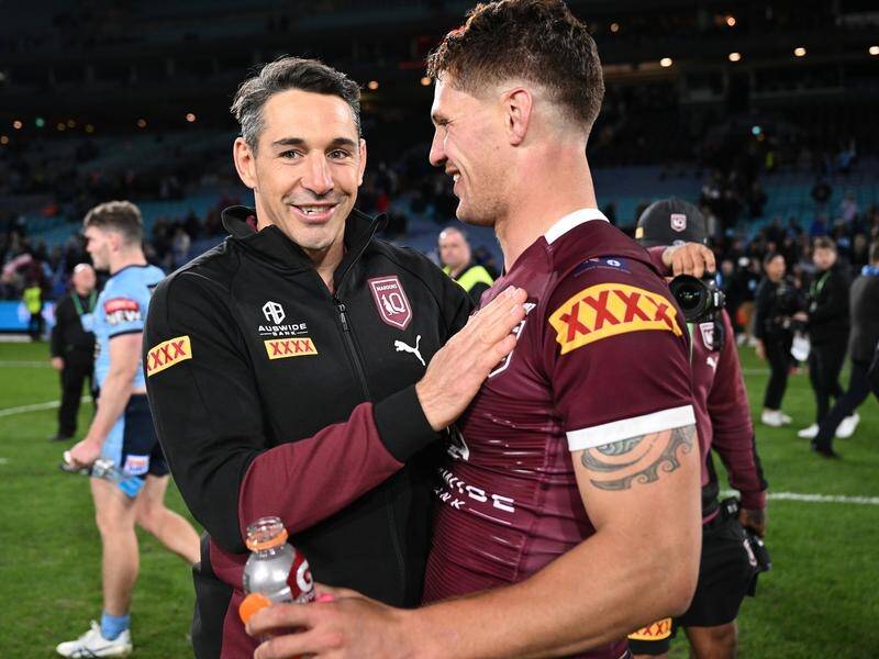 Maroons coach Billy Slater and fullback Kalyn Ponga celebrate their Origin I win over NSW in Sydney.