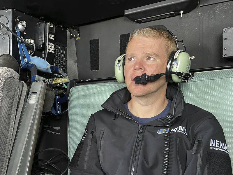 NZ Prime Minister Chris Hipkins surveyed the deadly Auckland flooding from the air on Saturday. (AP PHOTO)