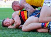 Adelaide defender Patrick Parnell was left concussed in the Crows' 32-point AFL loss to Richmond. (Matt Turner/AAP PHOTOS)