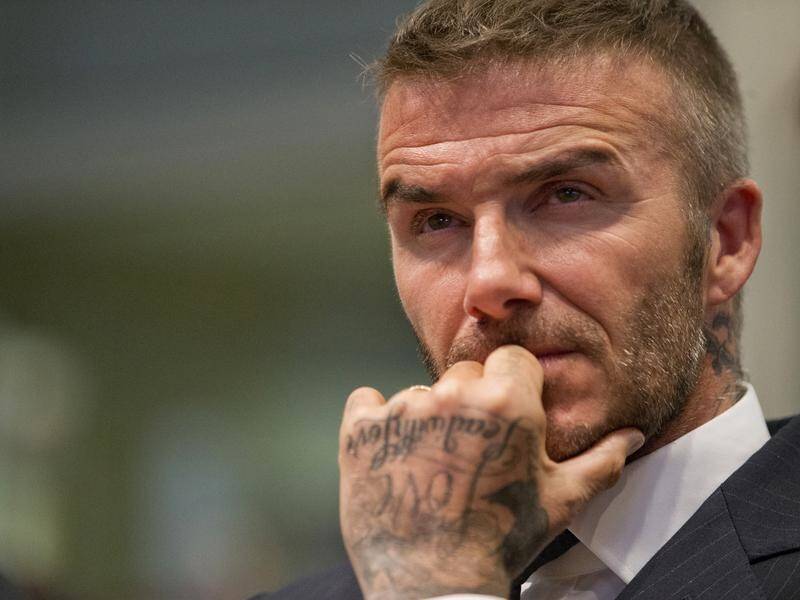 David Beckham has been given a court date after allegedly being seen using his phone while driving.