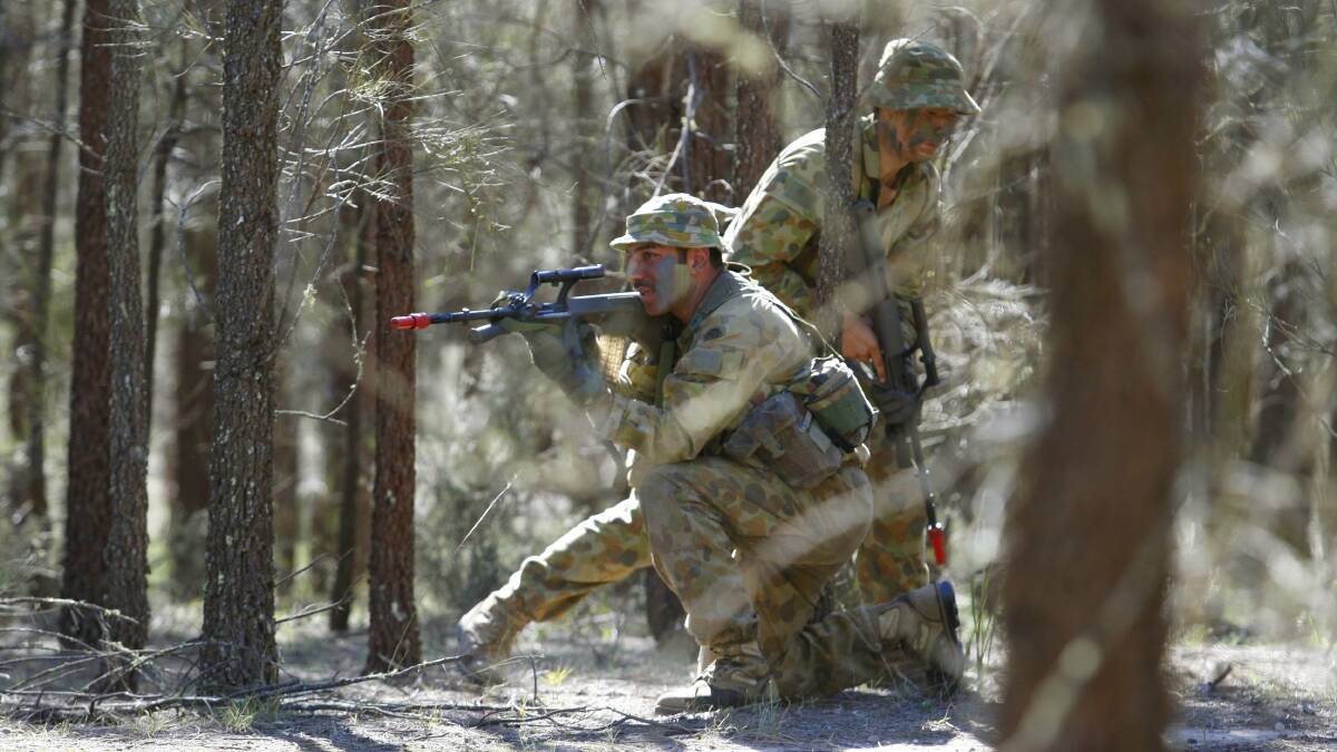 TRAINING: Army reserve soldiers taking part in a training exercise at Singleton Army Base in May 2014 . Photo: Peter Stoop