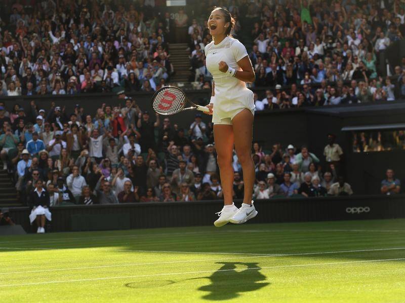 British teenager Emma Raducanu leaps for joy after winning her first-round match at Wimbledon.