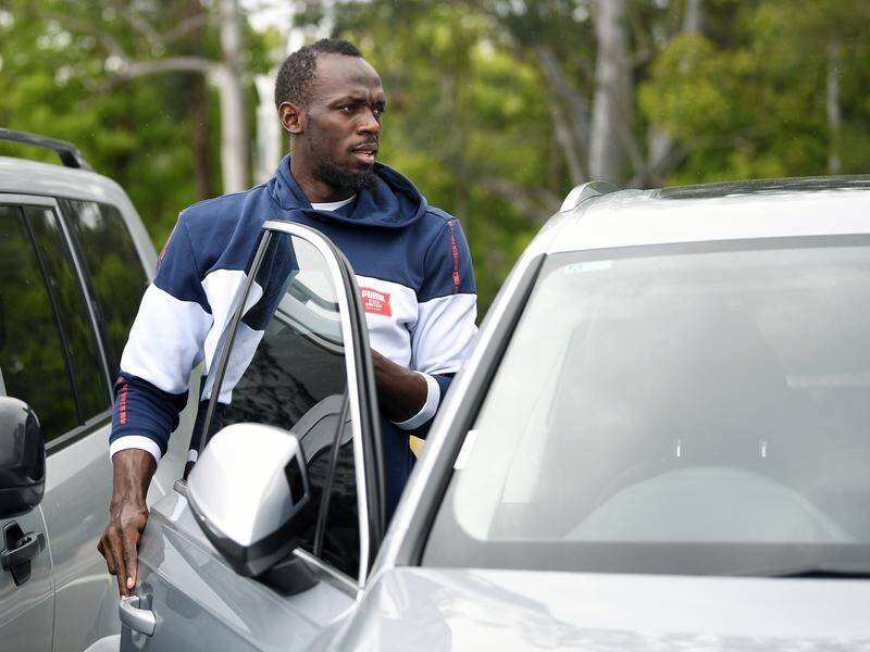 Usain Bolt heads for his car after completing training with Mariners' reserves team on Wednesday.