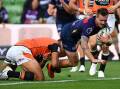 Cameron Munster scored a try on his return for Melbourne in a 24-12 NRL win over Wests Tigers. (James Ross/AAP PHOTOS)