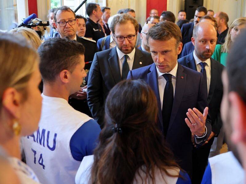 French President Emmanuel Macron visited rescuers and the stabbing victims and their families. (EPA PHOTO)