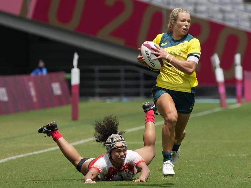 Emma Tonegato scored a hat-trick in Australia's demolition of Japan in their rugby sevens opener.