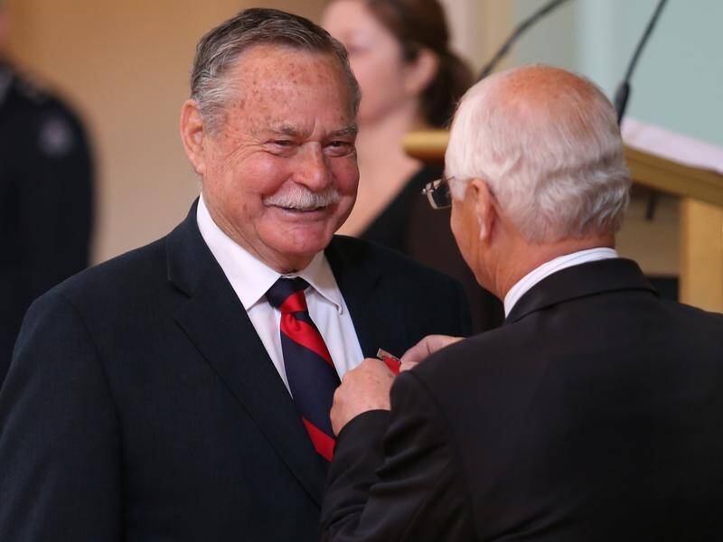 Australian Rules icon Ron Barassi, seen here receiving his bravery award in 2013, has died aged 87. (David Crosling/AAP PHOTOS)