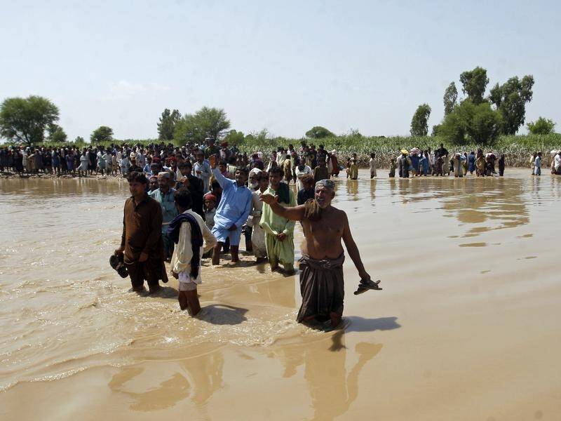 People in many parts of Pakistan are struggling to get basic necessities weeks after flooding. (AP PHOTO)