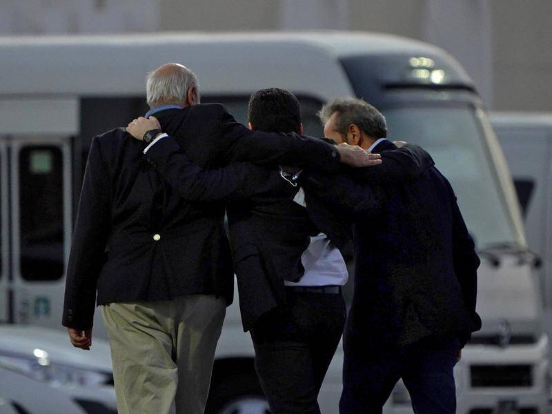 Morad Tahbaz, Siamak Namazi and Emad Sharqi landed in Qatar after taking a flight from Iran. (AP PHOTO)