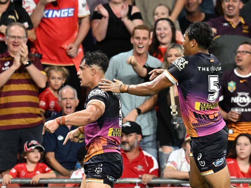 Kotoni Staggs (L) roared that Suncorp Stadium was the Broncos' home after his match-winning score. (Darren England/AAP PHOTOS)