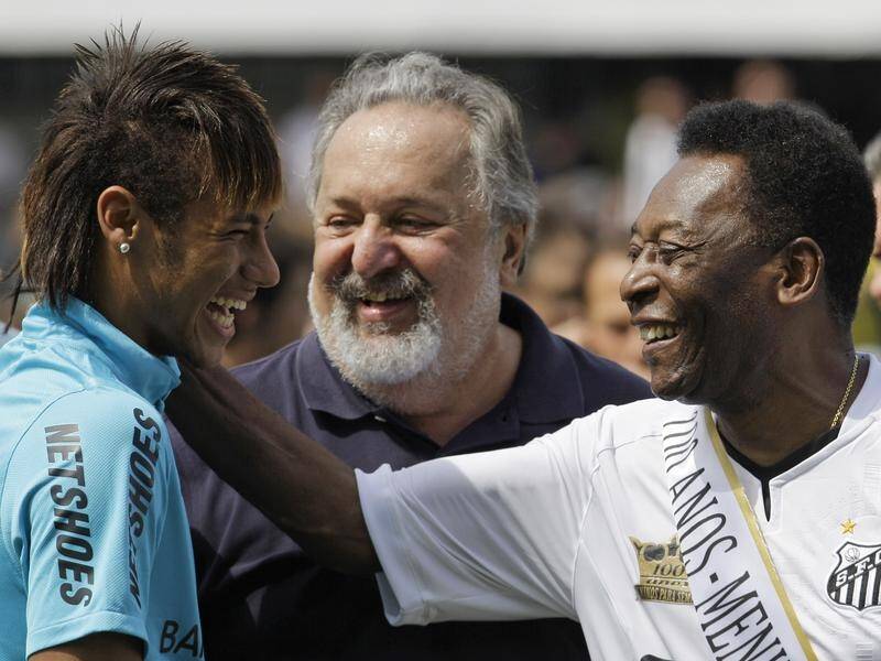 Pele, here sharing a moment with a young Neymar in 2012, has urged the star to continue to shine. (AP PHOTO)