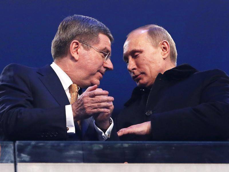 IOC President Thomas Bach (l) with Russian President Vladimir Putin (r) at Sochi 2014. (EPA PHOTO)