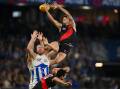 Essendon have confirmed their place in the AFL top eight with a six-point win over North Melbourne. (Morgan Hancock/AAP PHOTOS)