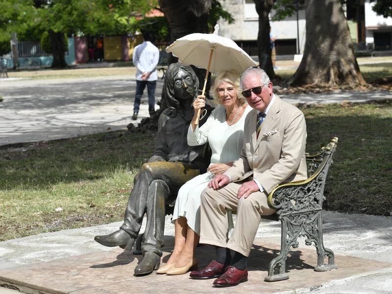 Charles and Camilla at the John Lennon memorial bench in John Lennon Square in Havana, Cuba.