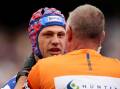 Newcastle's Kalyn Ponga (l) will visit a Canadian specialist in a bid to resolve concussion issues. (Brendon Thorne/AAP PHOTOS)