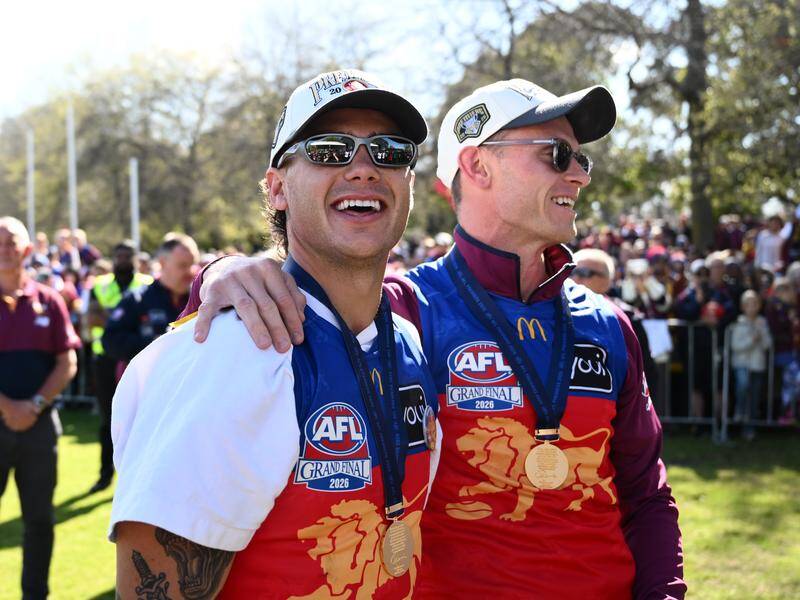 Cam Rayner (left) and Ryan Lester enjoy the spoils of victory at the Brunswick Oval fan event. Photo: Joel Carrett/AAP PHOTOS Cam Rayner (left) and Ryan Lester enjoy the spoils of victory at the Brunswick Oval fan event. Photo: Joel Carrett/AAP PHOTOS