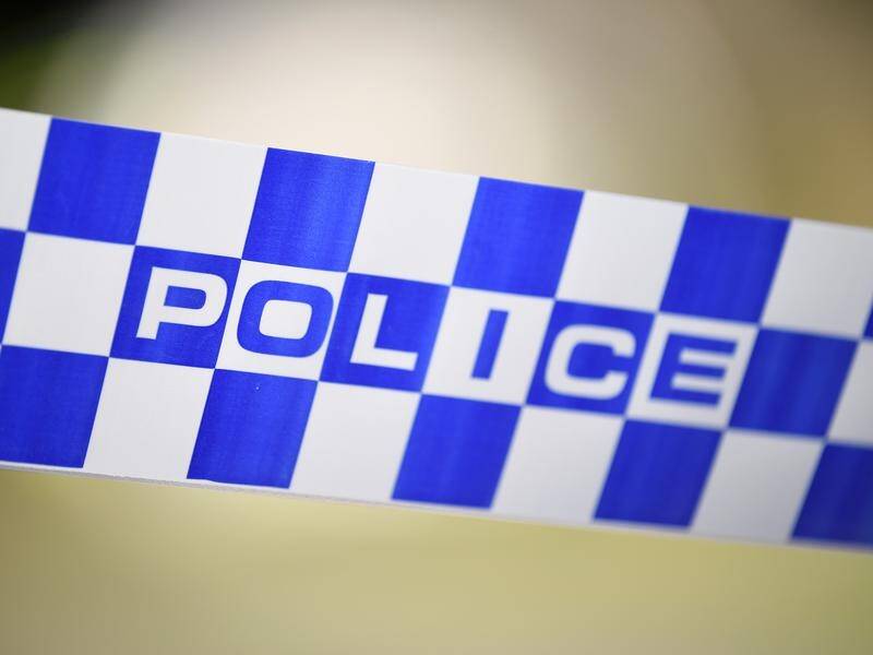 A man has been arrested in Sydney over the discovery of a woman's body in a box at a Brisbane unit.