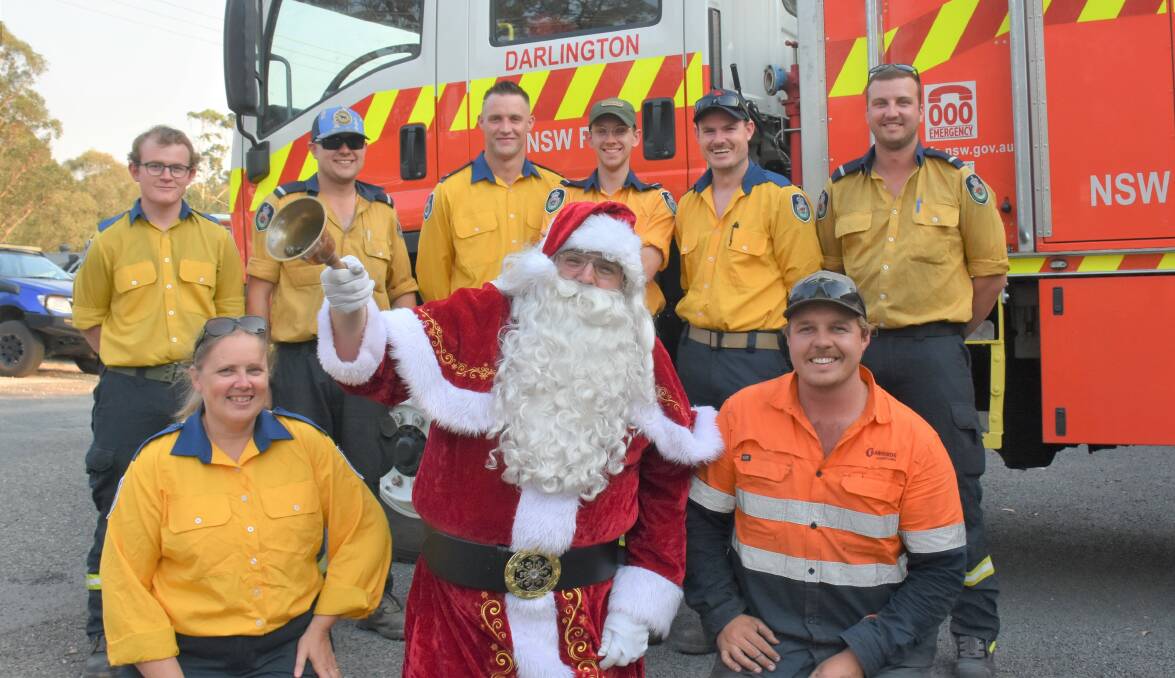 SANTA IS COMING: Darlington RFS members Ben Boehm, Aaron Stuart, Travis Cunningham, Ty Whitaker, Dean Mainey, Hayden Metcalf, Kathy Hoskin and Kirk Badior will join forces with Santa Claus over the next three weeks.