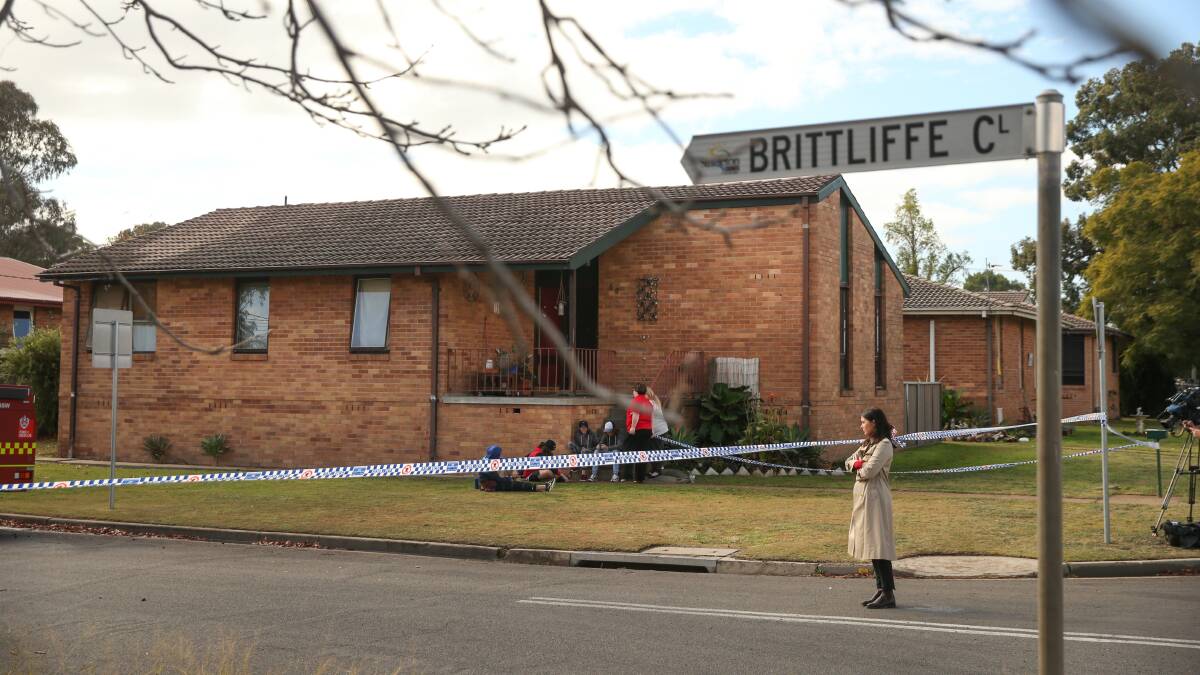 SCENE: Police tape across Brittliffe Street, where the family's house was destroyed by fire, on Wednesday. Picture: Marina Neil 