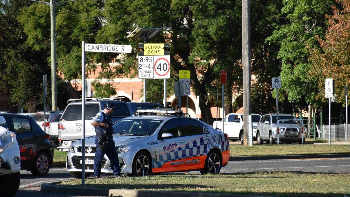 SINGLETON residents are being urged to avoid the Queen Street area on Wednesday afternoon as police continue to search for a man who escaped custody.