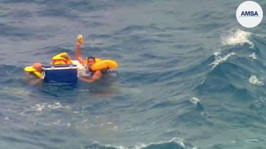 Dramatic ocean rescue as three spotted clinging to esky