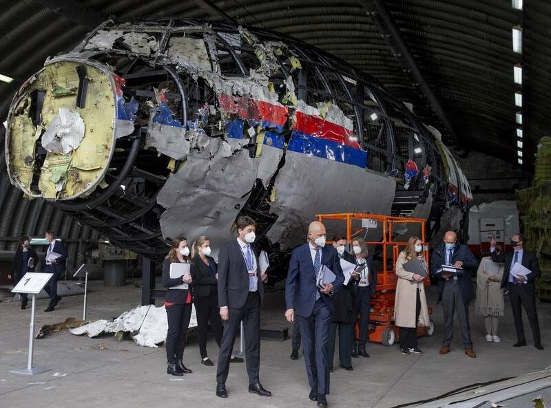 Judges view the reconstructed wreckage of Malaysia Airlines Flight MH17 at a Dutch air base.