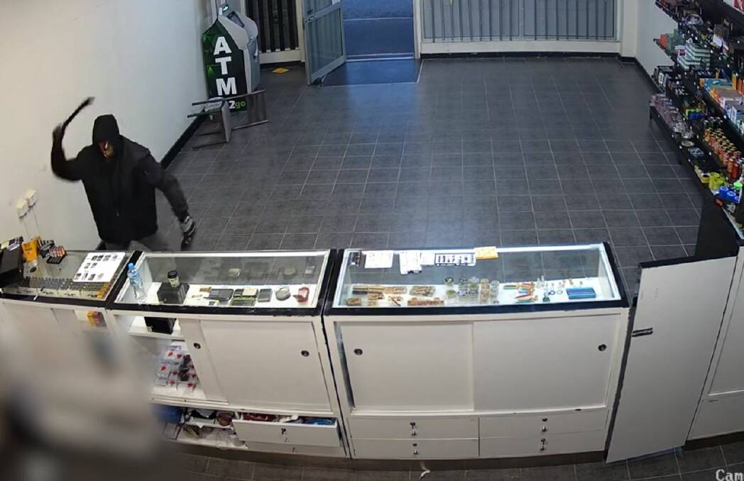 Police are hunting for machete-wielding bandit after attempted robbery in a Rockhampton tobacconist. Pictures by Queensland Police 