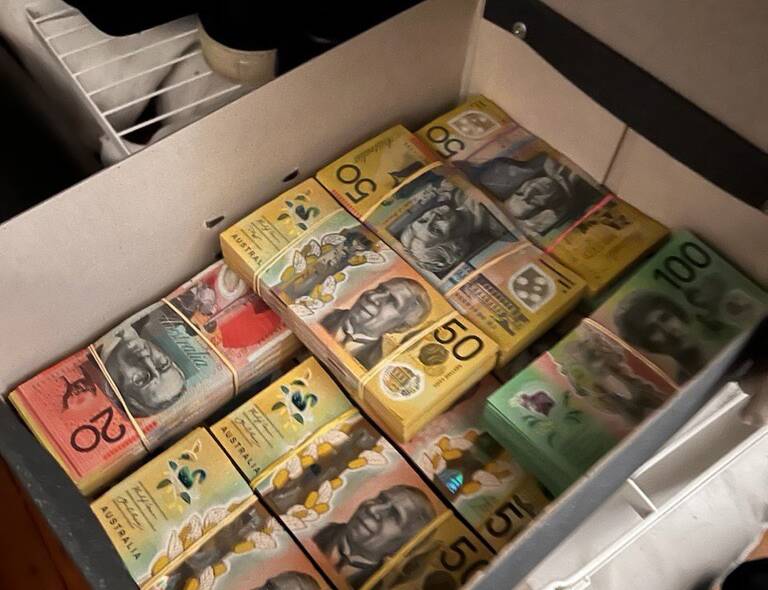 More than $1.7 million in cash was seized by police during raids on a number of properties. Picture by NSW Police 