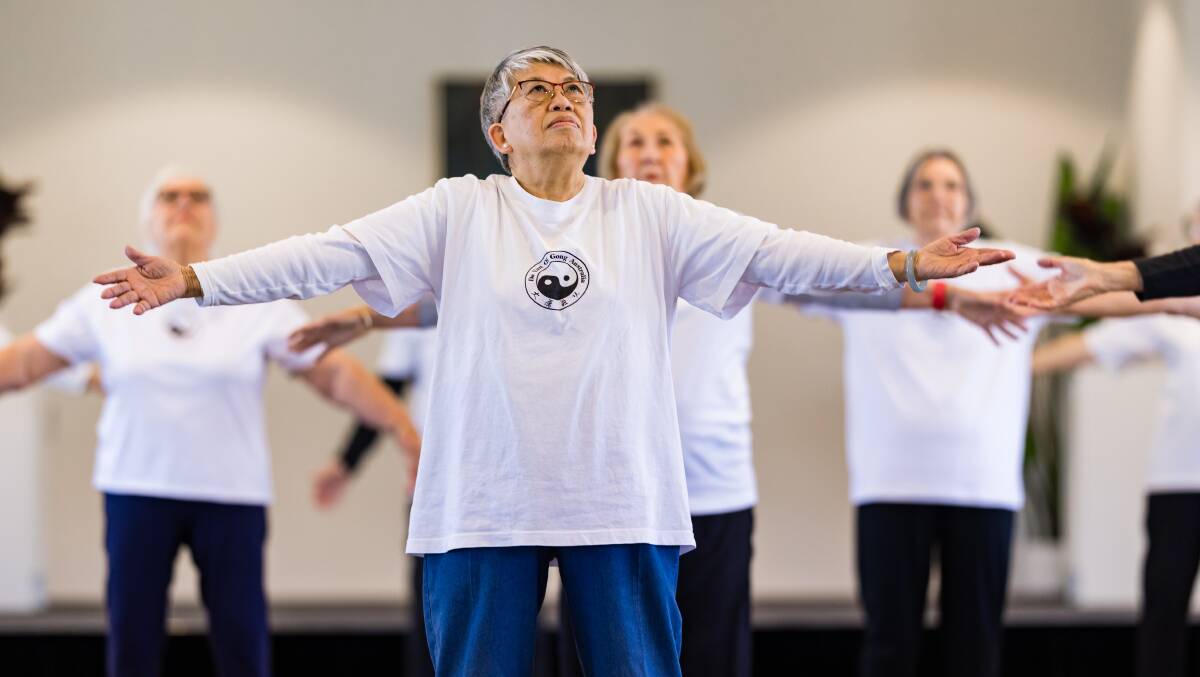 Janita Ying leads a group in the ancient art of qi gong. Picture suppled