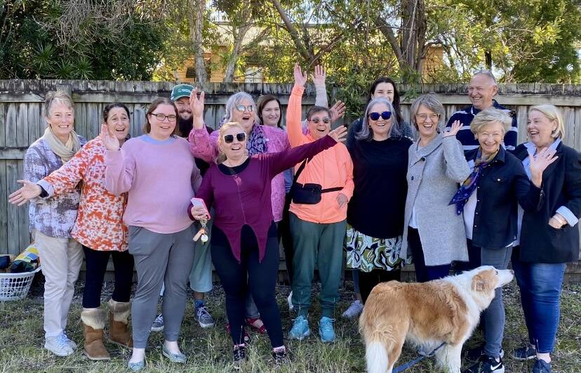 Some of the people involved with the Sharing With Friends project meet neighbours at the Darra development site. Picture supplied