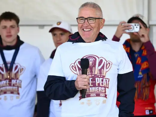 Brisbane Lions coach Chris Fagan speaks to the crowd after his side's epic AFL grand final win. Photo: Joel Carrett/AAP PHOTOS