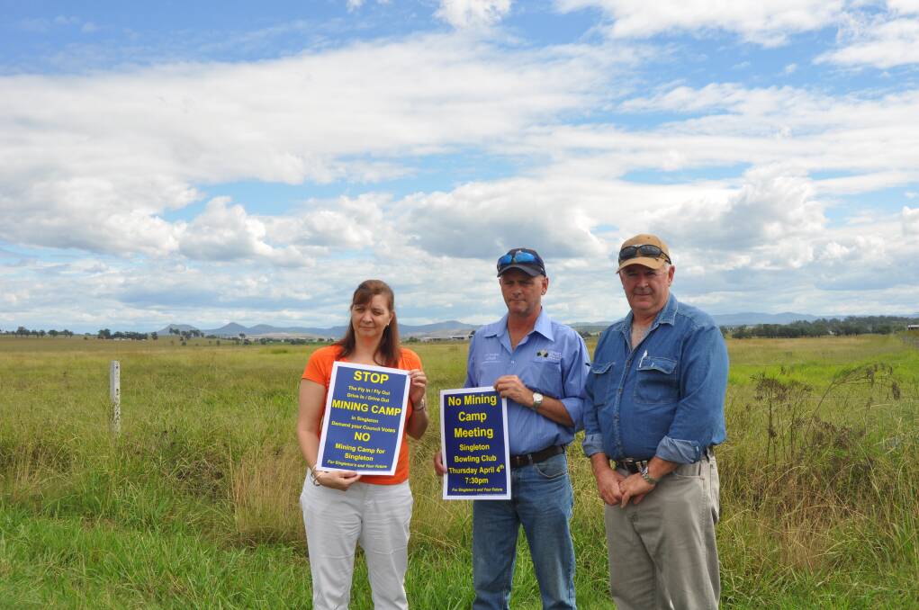 APRIL: STANDING FIRM:Better Future for Singleton Shire Association Rebecca Williams with concerned residents Robert Ball (left) and Mark Ryan at the site of the proposed $101 million mining camp development on the outskirts of town.