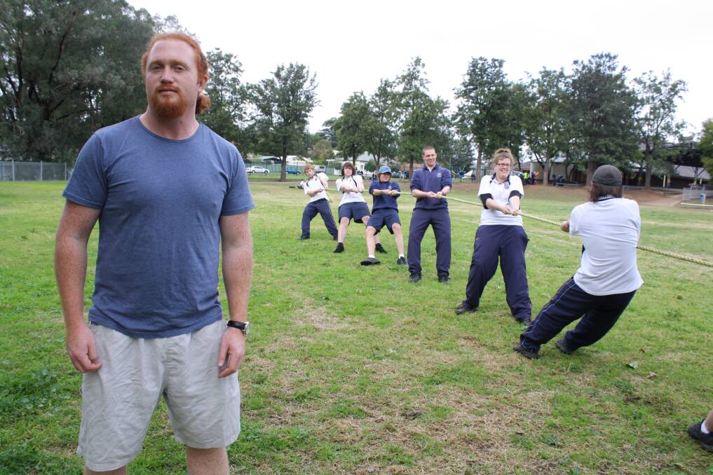 JULY: BEST FOOT FORWARD:National tug-of-war champion Ben Hoffman shared some advice with the Muswellbrook High School team in preparation for the Aberdeen Highland Games.