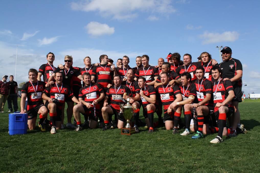 SEPTEMBER: CHAMPIONSHIP PERFORMANCE:The Singleton Bulls playing and coaching squad celebrate their win over the Muswellbrook Heelers in the first division B grade decider at Maitland. The Muswellbrook Heelers took out the first grade final.